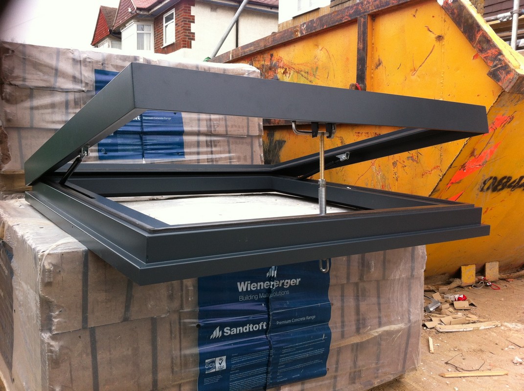 Opening flat roof skylight in anthracite grey installed in Teddington